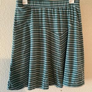 Nau size M green & white striped skirt. Worn w/ a little bit of fade.